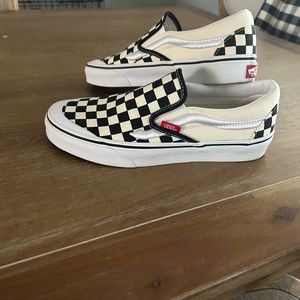Brand new slip on checkerboard vans with embroidered vans stripe